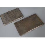 Two engine turned silver cigarette cases, largest 15.2cm.