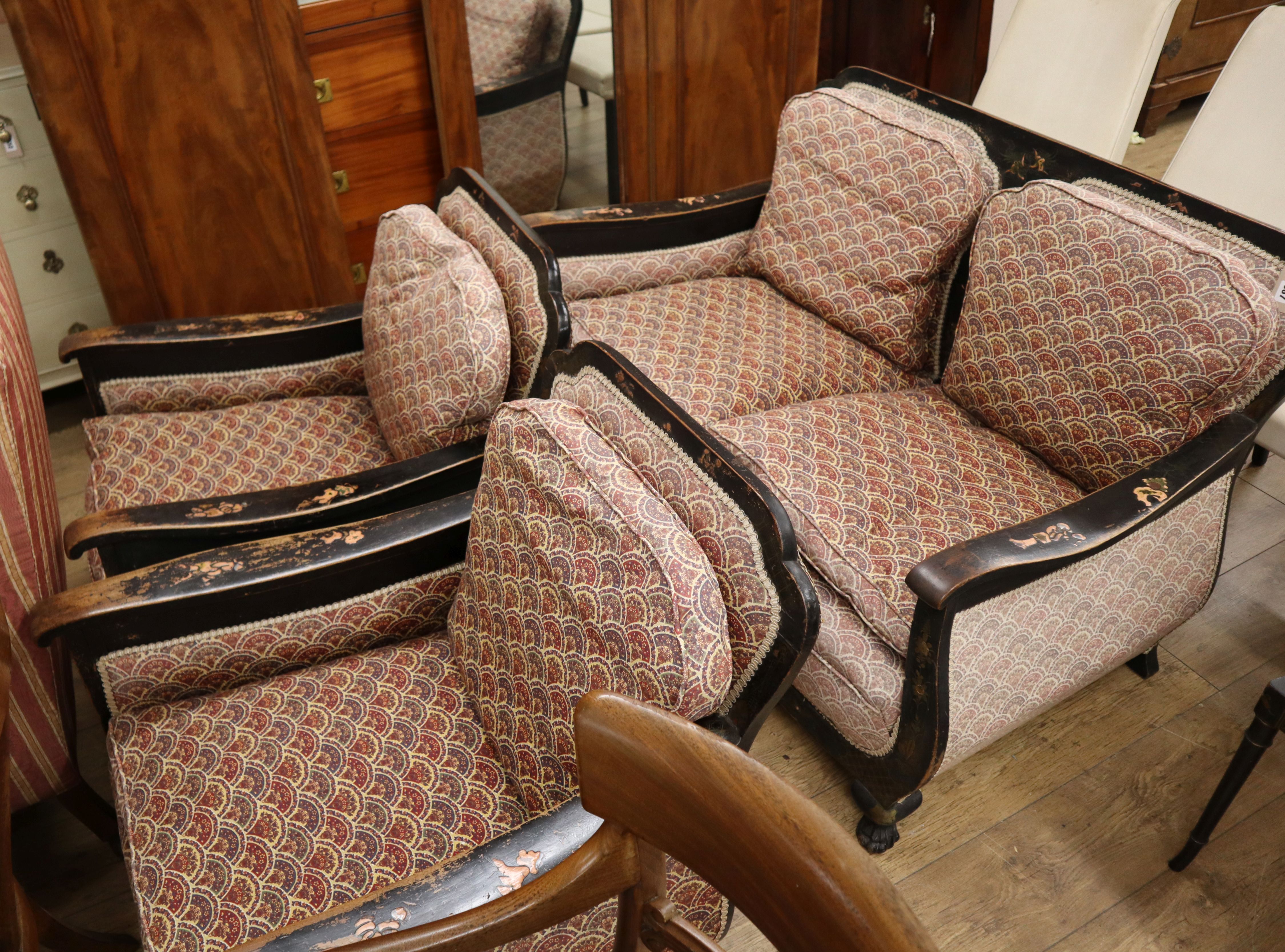 A 19th century chinoiserie lacquered three piece bergere suite (now upholstered)