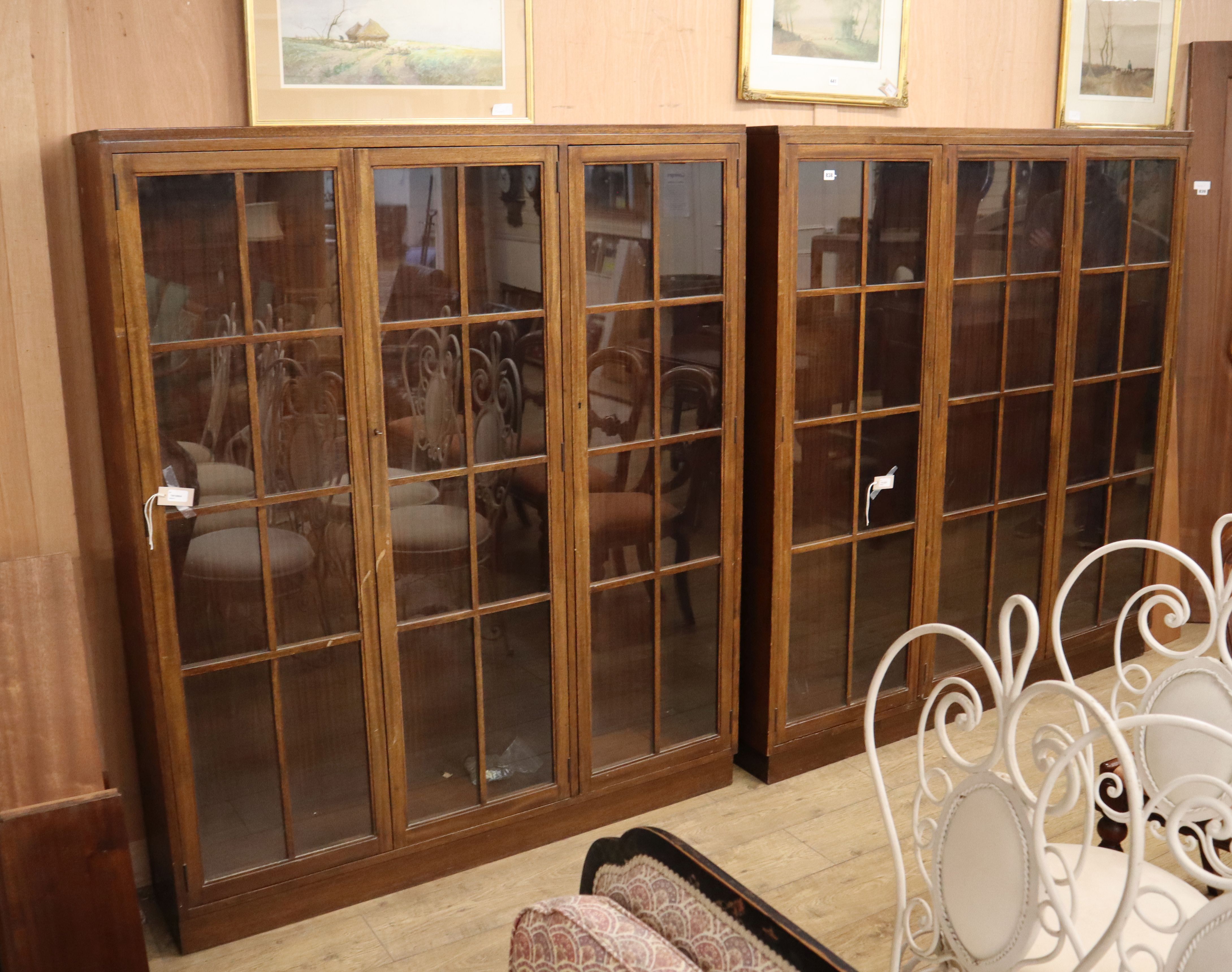A near pair of mahogany glazed bookcases Larger 160cm