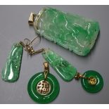 A carved jade pendant of tapered rectangular form, a similar pair of earrings and two jade bi-disc