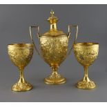 A George III silver gilt two handled presentation pedestal cup and cover by Soloman Hougham and a