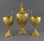 A George III silver gilt two handled presentation pedestal cup and cover by Soloman Hougham and a