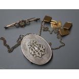 A pair of 9ct. gold rectangular cufflinks, a bar brooch, a silver locket on chain.