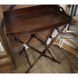 A Victorian mahogany bow fronted butler's tray on folding stand Tray W.74cm