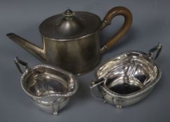 A George V silver oval teapot and a silver cream jug and matching silver sugar bowl, gross 16.5 oz.