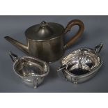 A George V silver oval teapot and a silver cream jug and matching silver sugar bowl, gross 16.5 oz.