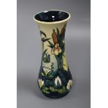 A Moorcroft Iris, Lily and Bulrushes vase height 21cm