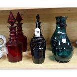 Five Victorian coloured glass decanters and another