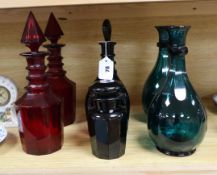 Five Victorian coloured glass decanters and another