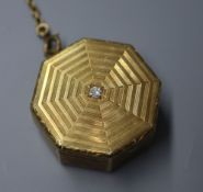 A 1920's 14k engraved yellow metal and diamond set octagonal compact?, with 14kt yellow metal