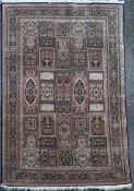 A Persian silk rug 184 x 123cm