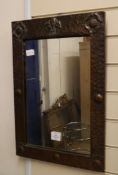 An Arts and Crafts copper mirror H.58cm