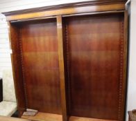 An oak open fronted bookcase W.200cm