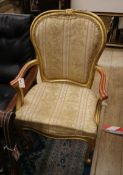 An early 20th century French giltwood elbow chair