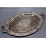 An American engraved sterling two handled oval tea tray, 48cm over handles, 36 oz.