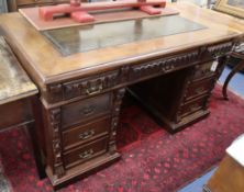 A late 19th century Continental carved walnut pedestal partners desk W.150cm