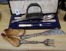 A pair of shoe trees, stirrups and plated servers etc