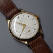 A gentleman's yellow metal Garrard manual wind wristwatch, c.1962; cased.