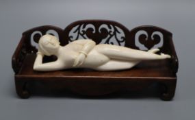 A Chinese ivory doctors figure with a hardwood stand, c. early 20th century