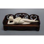 A Chinese ivory doctors figure with a hardwood stand, c. early 20th century