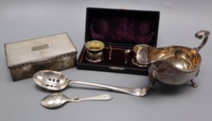 A silver gravy boat, a pair of cased silver salts, a silver cigarette box (a.f.) and two spoons.