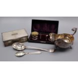 A silver gravy boat, a pair of cased silver salts, a silver cigarette box (a.f.) and two spoons.