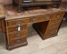 A Georgian style walnut pedestal desk W.120cm