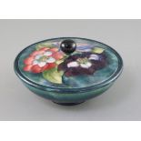 A Moorcroft 'clematis' powder bowl and cover, 1930/40's, impressed mark W. Moorcroft Potter to HM