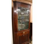 A George III mahogany standing corner cabinet H.214cm