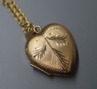 A modern 9ct gold heart pendant on a 9ct gold chain.