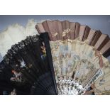 A Victorian painted lace and mother of pearl fan, another painted fan with bone sticks and three