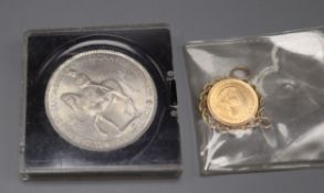 A gold 1/10 Krugerrand coin in pendant mount and a 1953 five shilling coin.