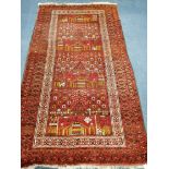 An Afghan rug 202 x 114cm