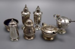 Two mid 20th century silver three piece condiment sets and one other silver pepperette.