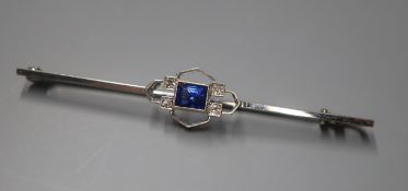 A 9ct white gold, sapphire and diamond set bar brooch, 56mm.