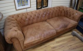 A large buttoned brown suede Chesterfield settee L.260cm approx.