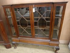 A George V mahogany inverse breakfront bookcase W.121cm