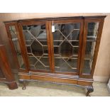 A George V mahogany inverse breakfront bookcase W.121cm