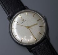 A gentleman's 1960's stainless steel Omega manual wind wrist watch, movement c.600, on later