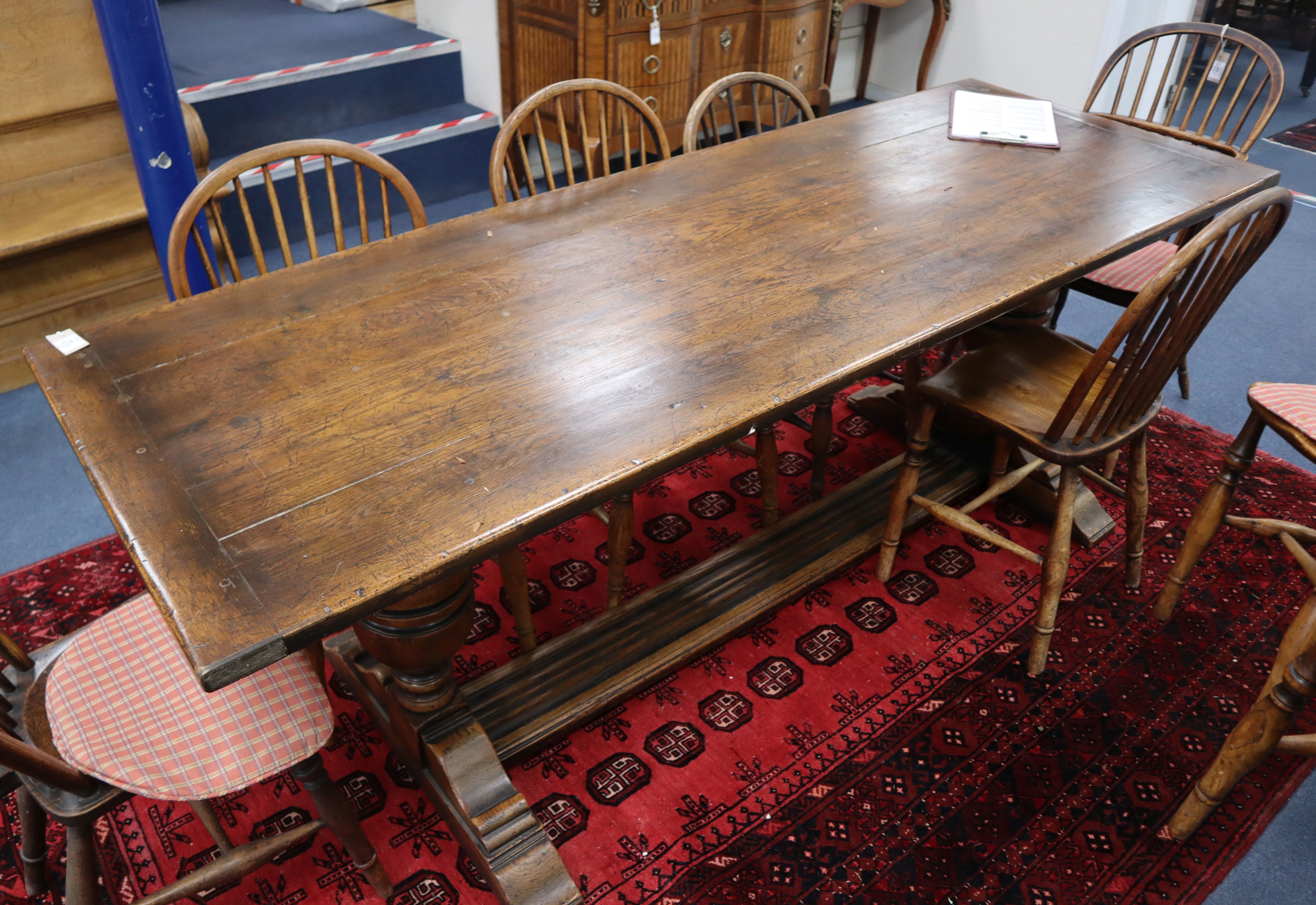 An 18th century style oak refectory dining table L.213cm