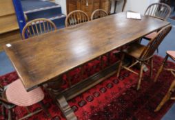 An 18th century style oak refectory dining table L.213cm