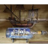 A ship in a bottle and a model galleon