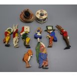 A group of miniature dolls and wooden toys