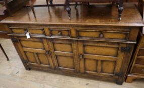 An 18th century style oak low dresser W.152cm