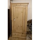 A Victorian pine single door wardrobe W.92cm