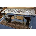 A 1970's mirrored console table