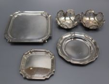 A late Victorian silver square waiter, London, 1895, a pair of silver small dishes, one other silver