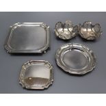 A late Victorian silver square waiter, London, 1895, a pair of silver small dishes, one other silver