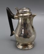 A late Victorian silver hot water jug, Thomas Bradbury & Sons, London 1897, gross 10 oz.