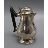 A late Victorian silver hot water jug, Thomas Bradbury & Sons, London 1897, gross 10 oz.